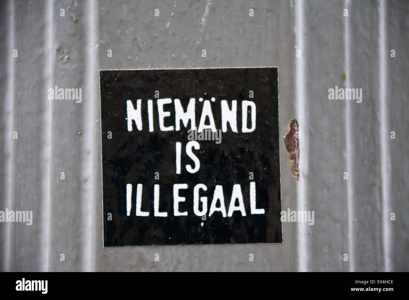 Sign saying nobody is illegal in Dutch language, Brussels, Belgium. Stock Photo