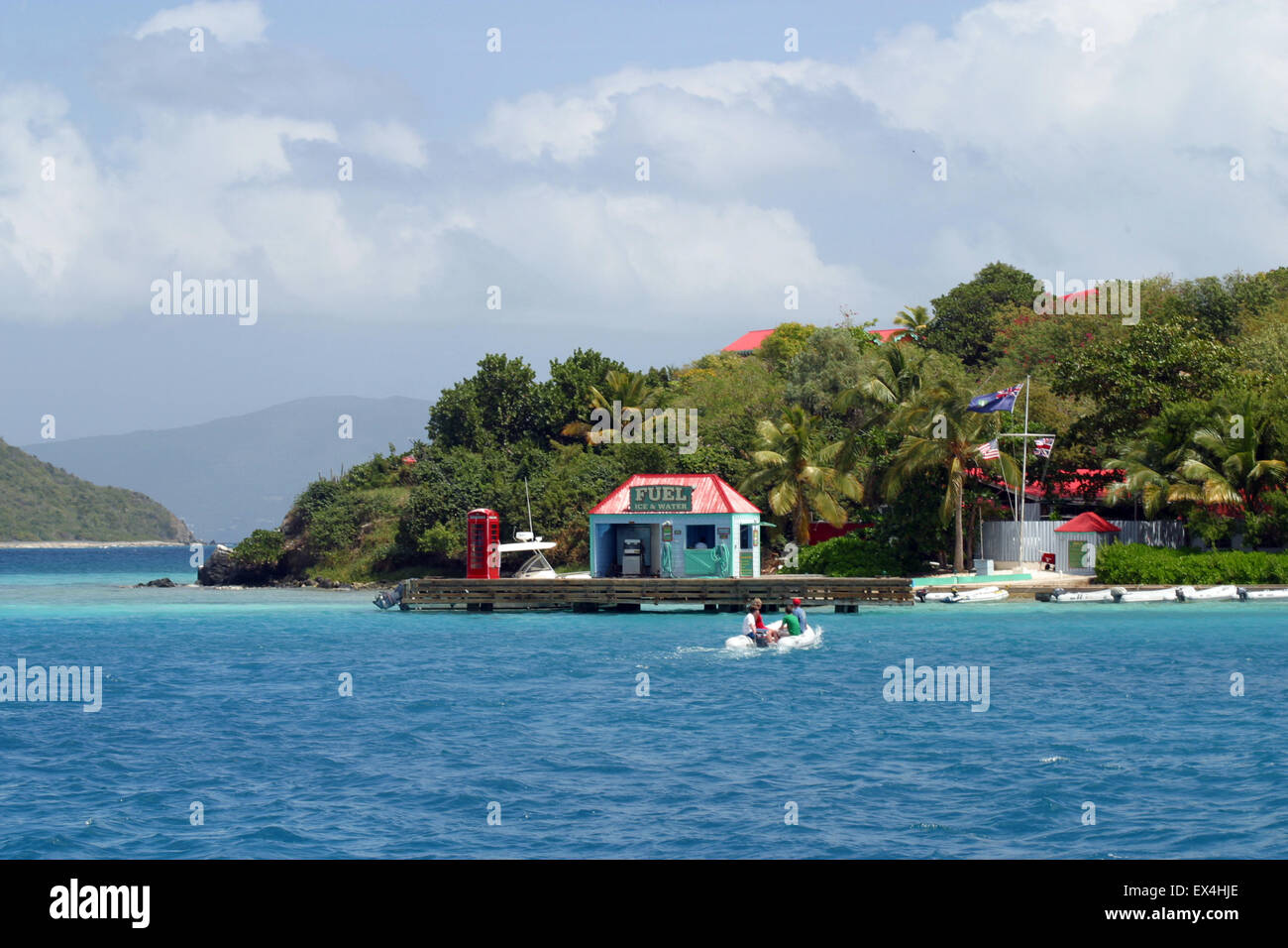 A few cruising sailors set out from the anchorage and take their dinghy