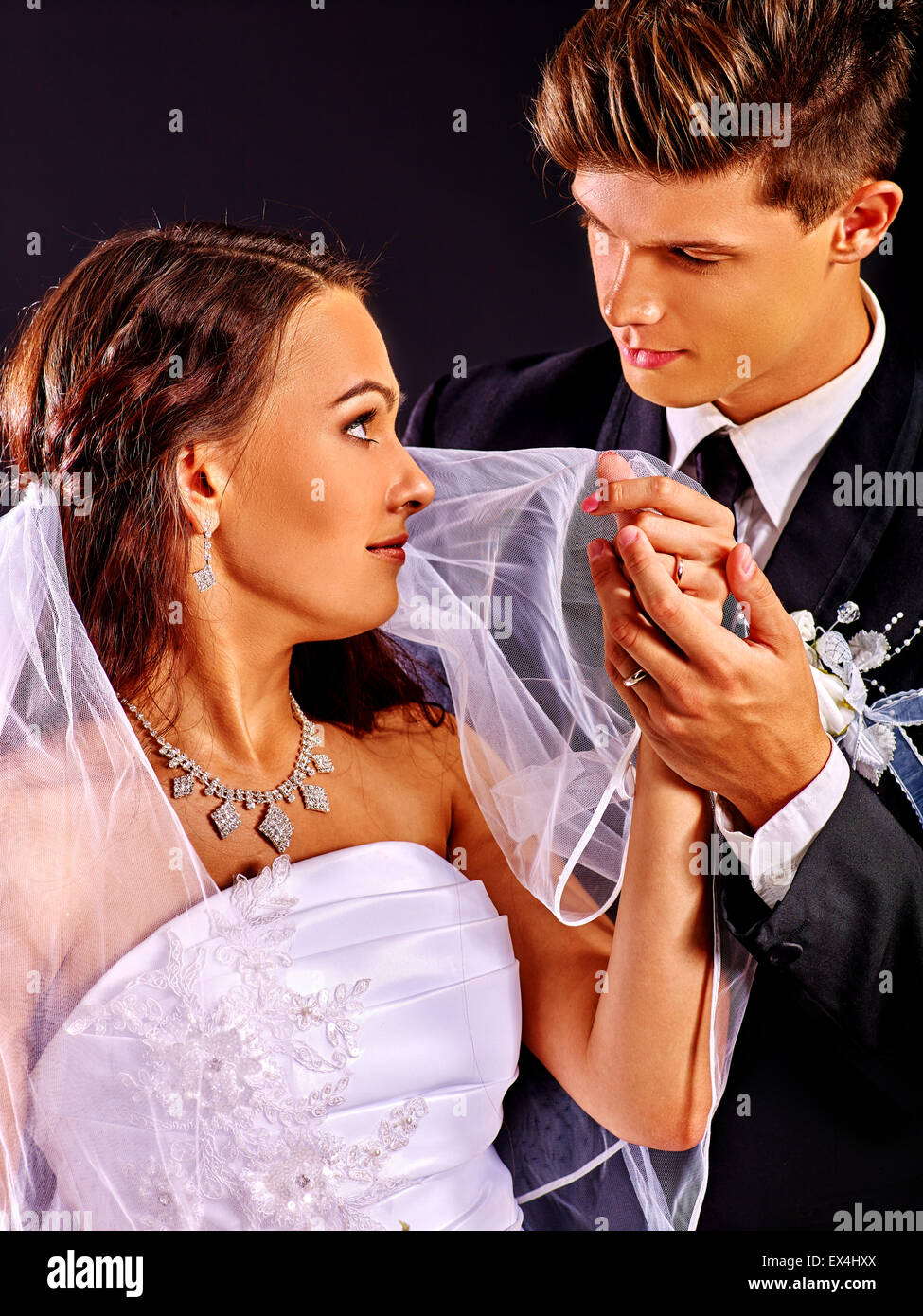 Couple wearing wedding dress and costume Stock Photo - Alamy