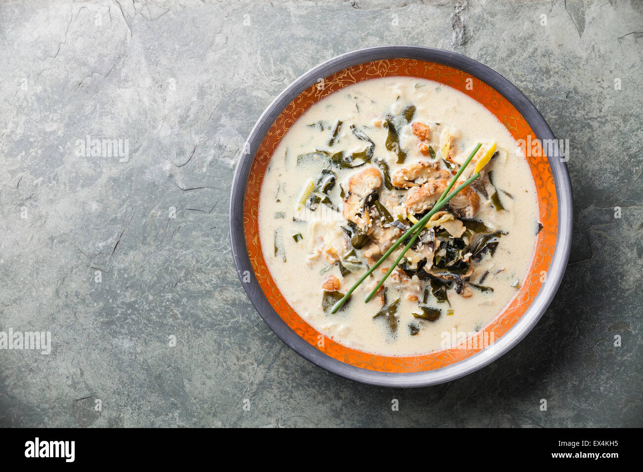 Creamy soup with Eel on stone slate background Stock Photo