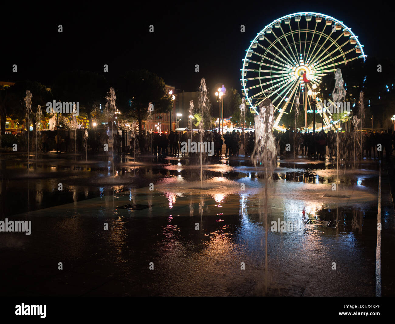 Nice's Miroir d'eau with ferries wheel in background Stock Photo