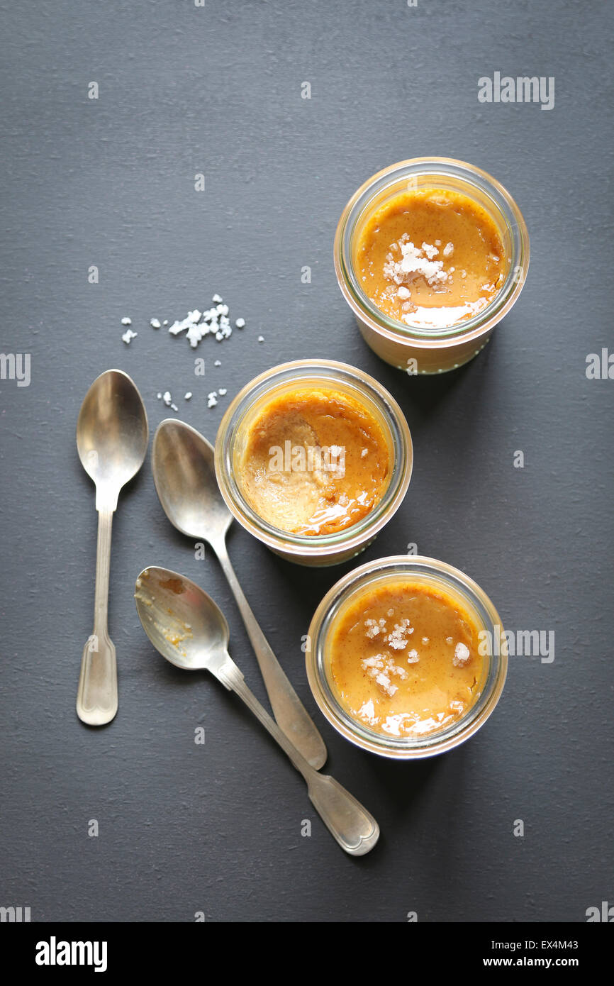 Three salted caramel pots de creme Stock Photo