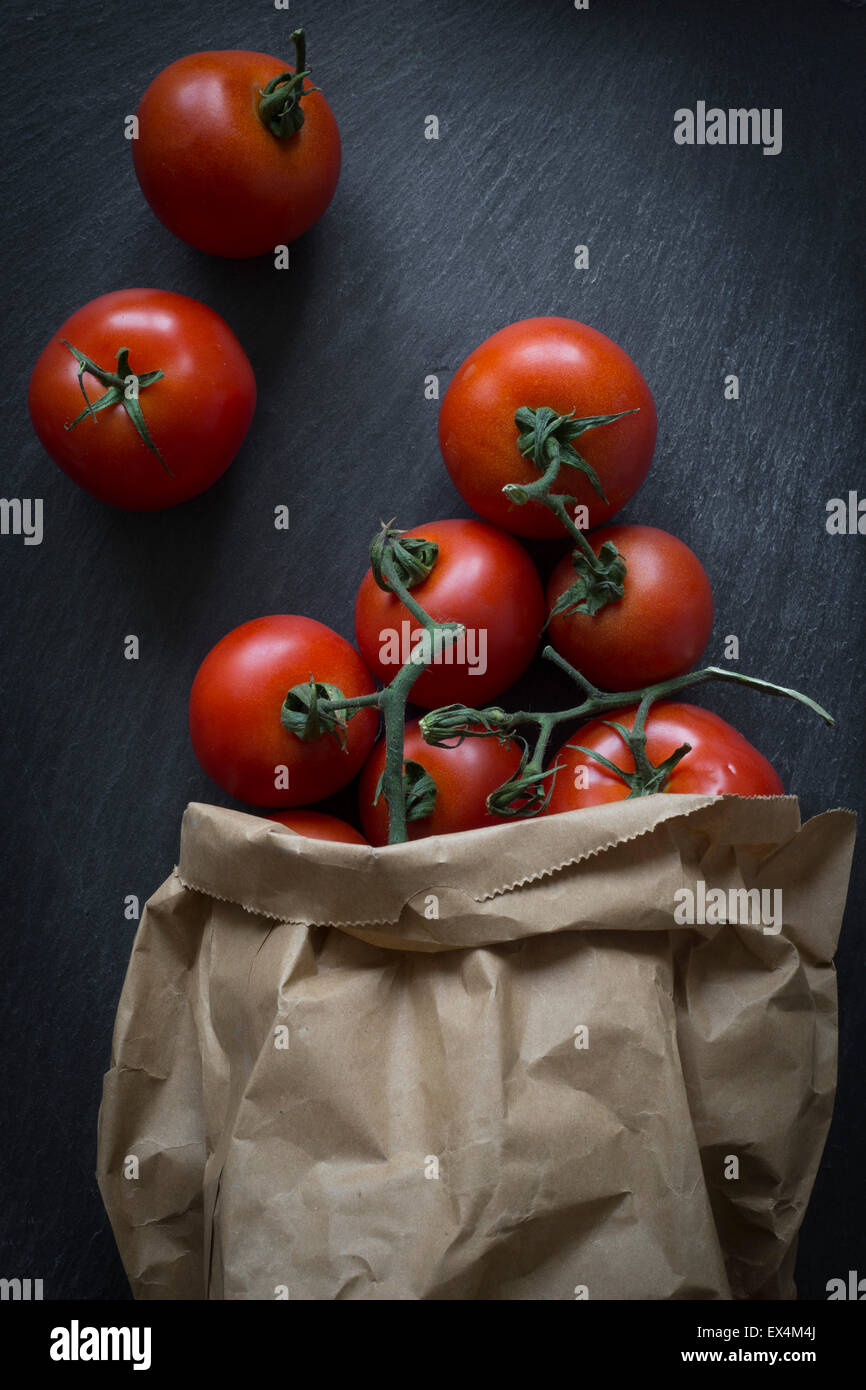 Tomatoes in paper bag on slate background. Top View Stock Photo Alamy