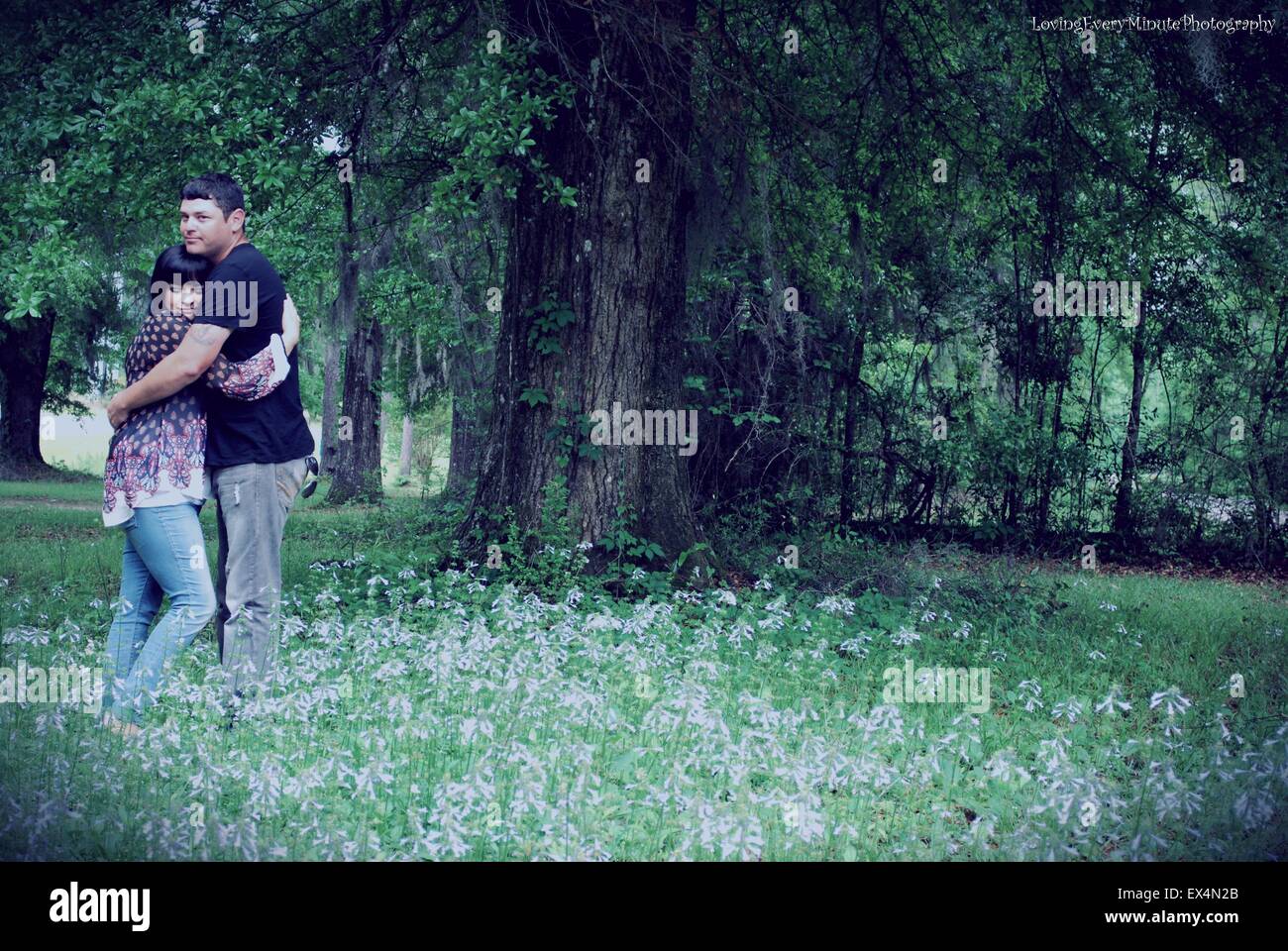 A beautiful meadow is just the backdrop for young love Stock Photo