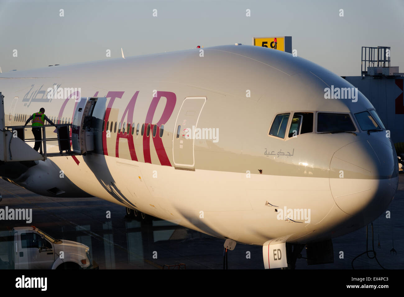 Food trolleys being loaded onto a Qatar Airlines plane at Montreal's Trudeau airport Stock Photo