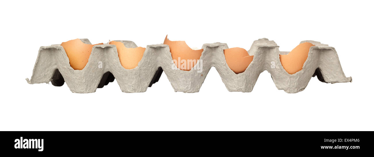Tray of cracked eggs isolated on white background Stock Photo