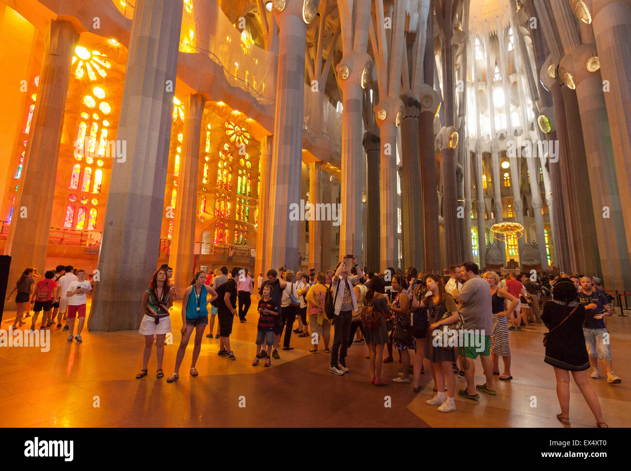 Tourists inside the Sagrada Familia Cathedral designed by Antoni Gaudi, Barcelona, Spain Europe Stock Photo