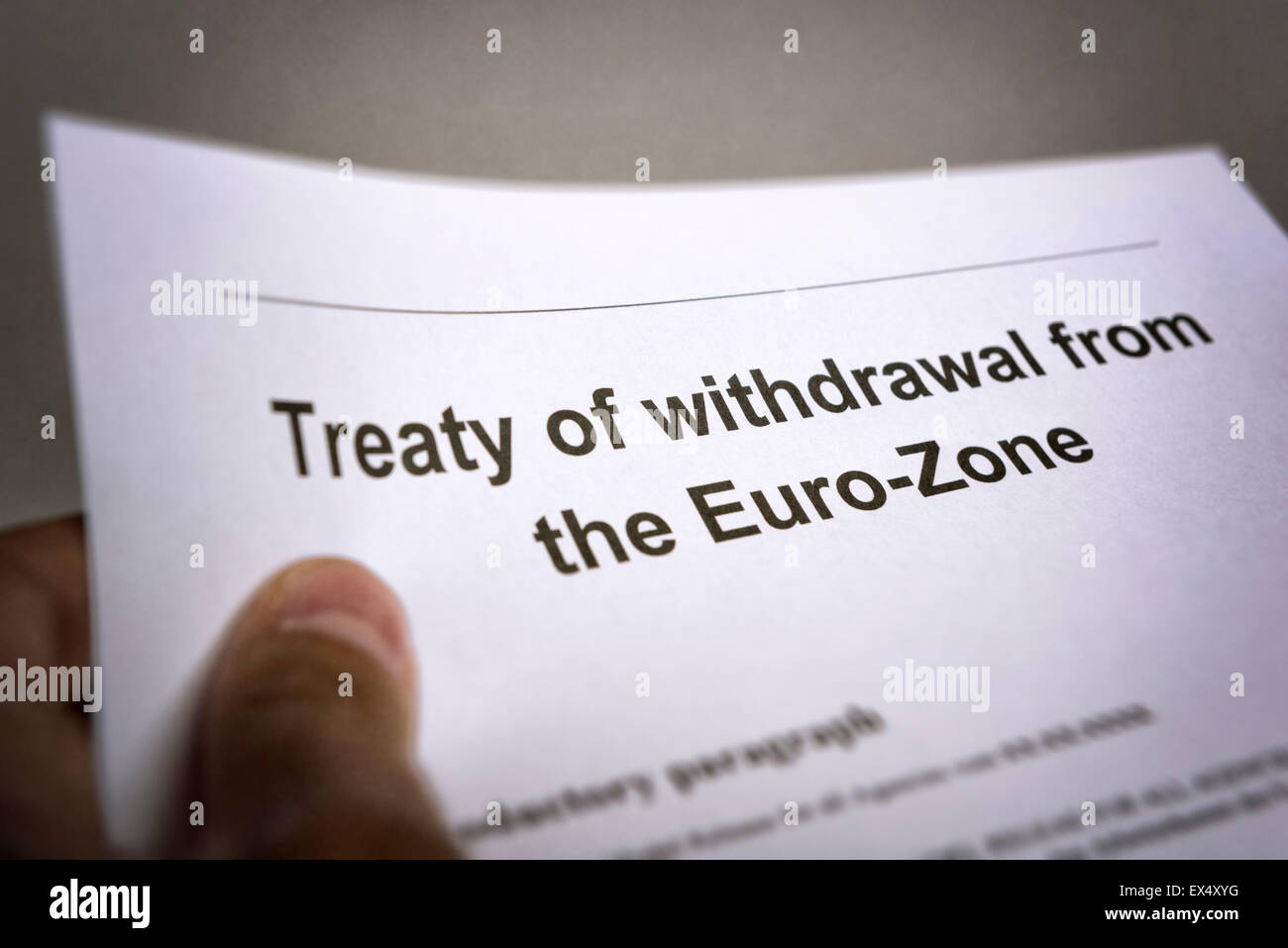 Man holding an treaty on the withdrawal from the euro zone in the hand Stock Photo