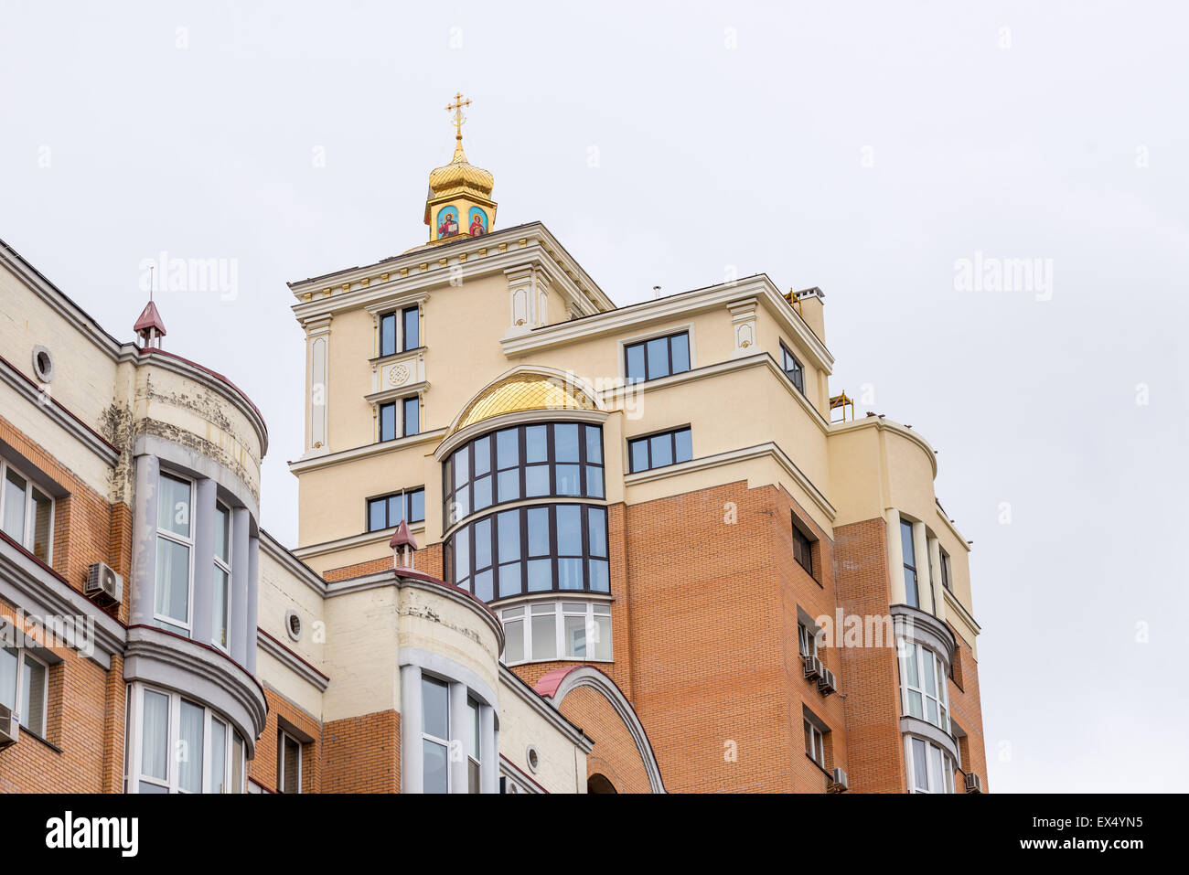 Kiev, Ukraine - April 15, 2014: An orthodox church on the top roof of a high building, near the Natalka Park in the Obolon distr Stock Photo