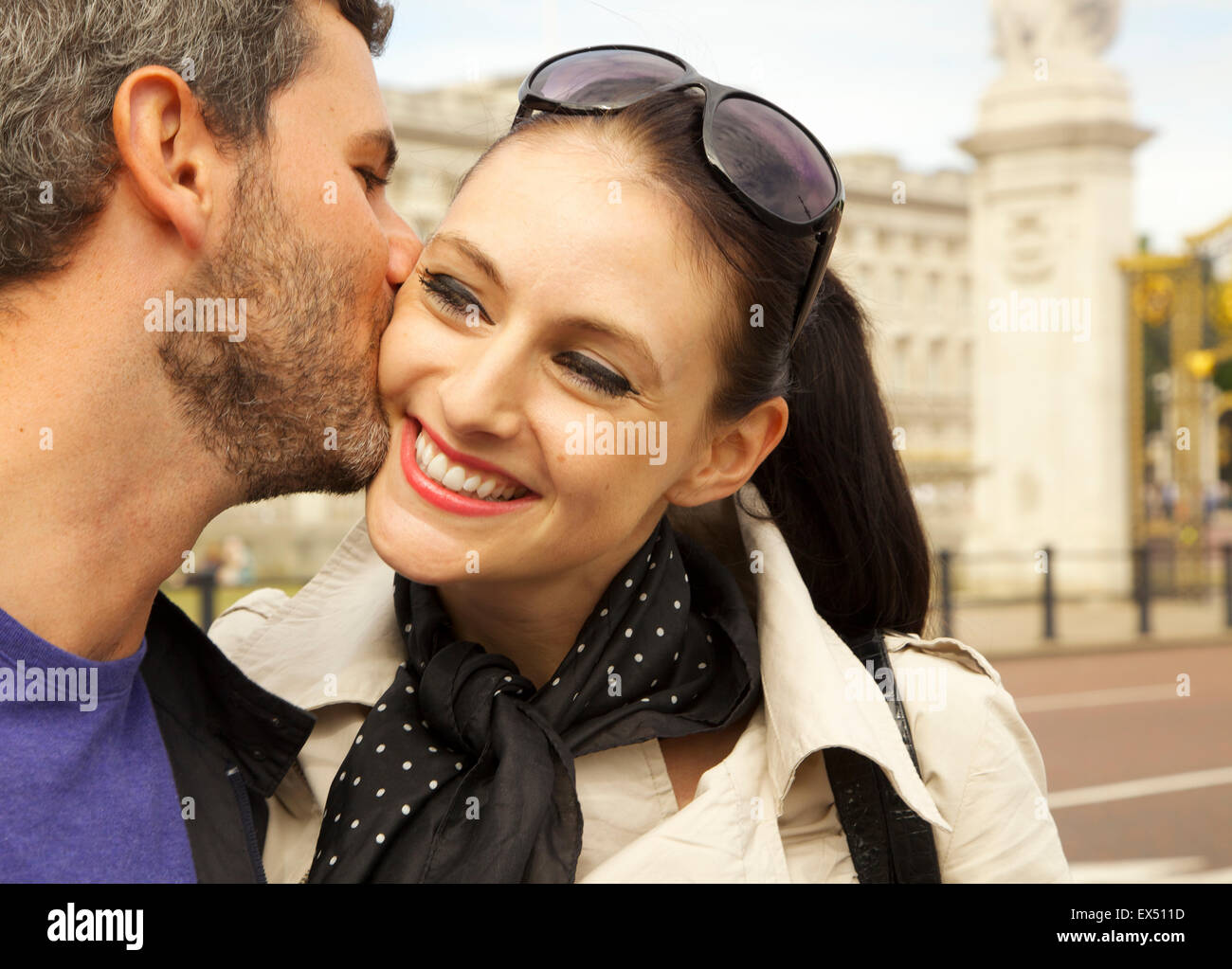Woman kissing man on the cheek hi-res stock photography and images - Alamy