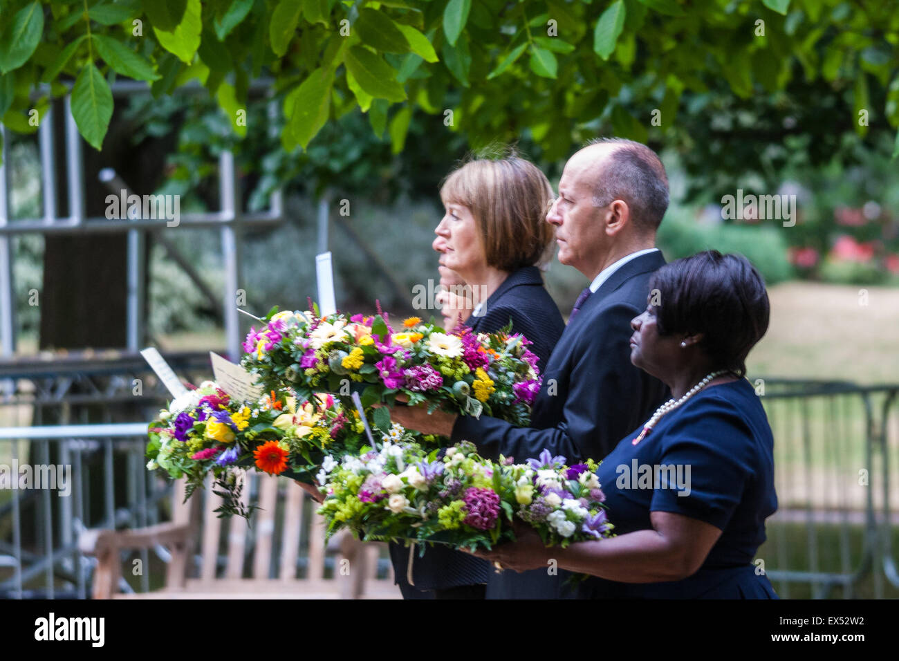 Hyde Park, London, July7th 2015. The Mayor of London Boris Johnson and other senior political figures, the Commissioners for transport and policing in the capital, as well as senior representatives of the emergency services lay wreaths at the 7/7 memorial in Hyde Park. PICTURED: (L-R)Harriet Harman, Chair of London Councils Jules Pipe and Chair of the London Assembly Jenette Arnold OBE Credit:  Paul Davey/Alamy Live News Stock Photo