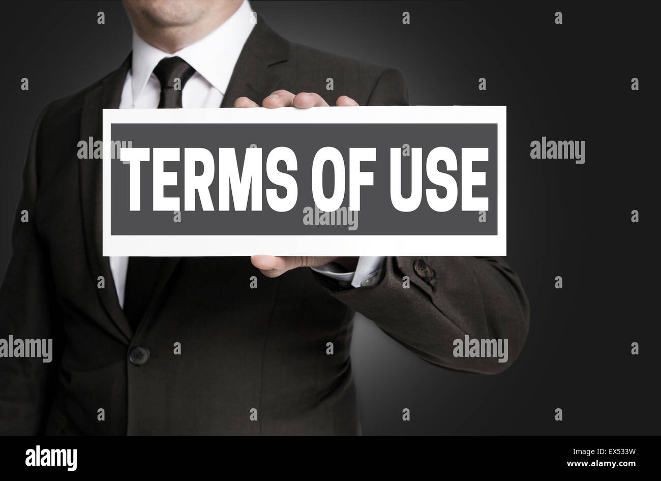 Terms of Use sign is held by businessman. Stock Photo