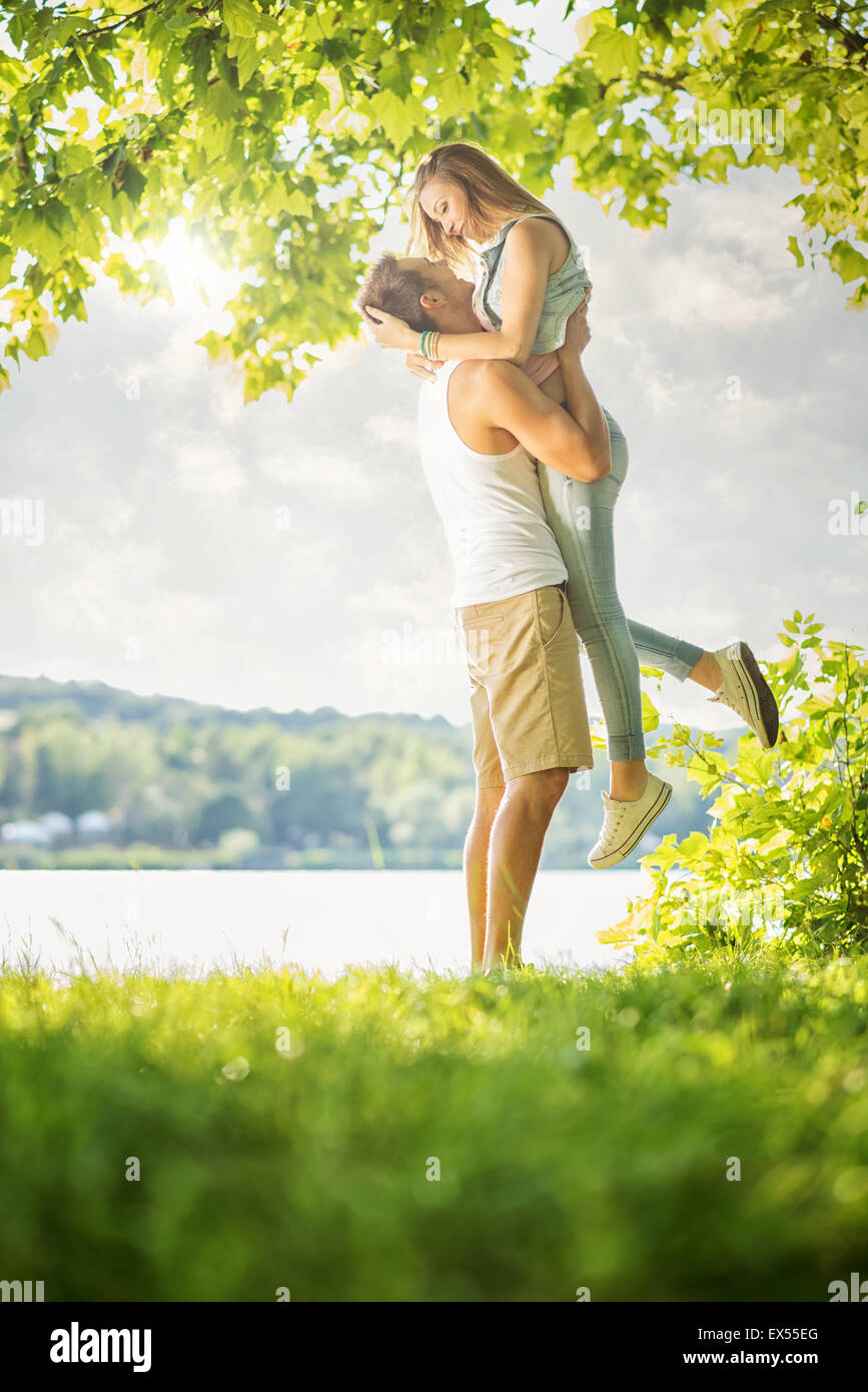 Park couple happy hug hi-res stock photography and images - Alamy