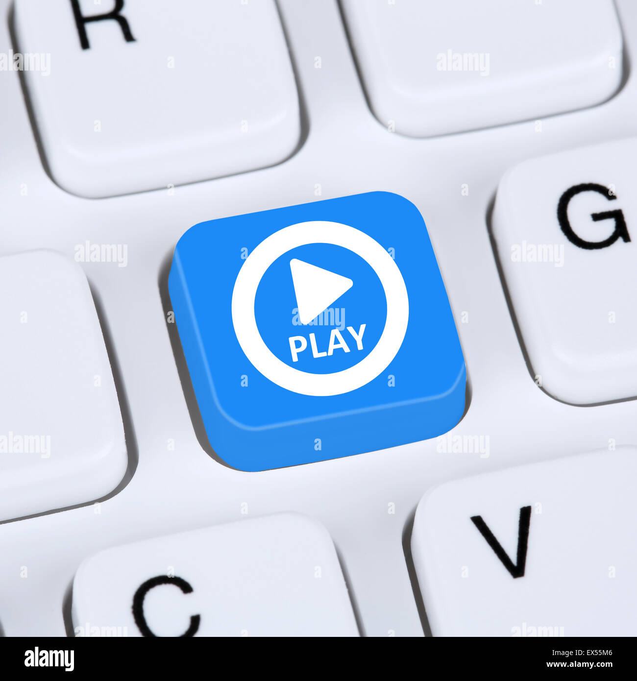Computer concept Play Button for listening to music or movie on internet keyboard Stock Photo
