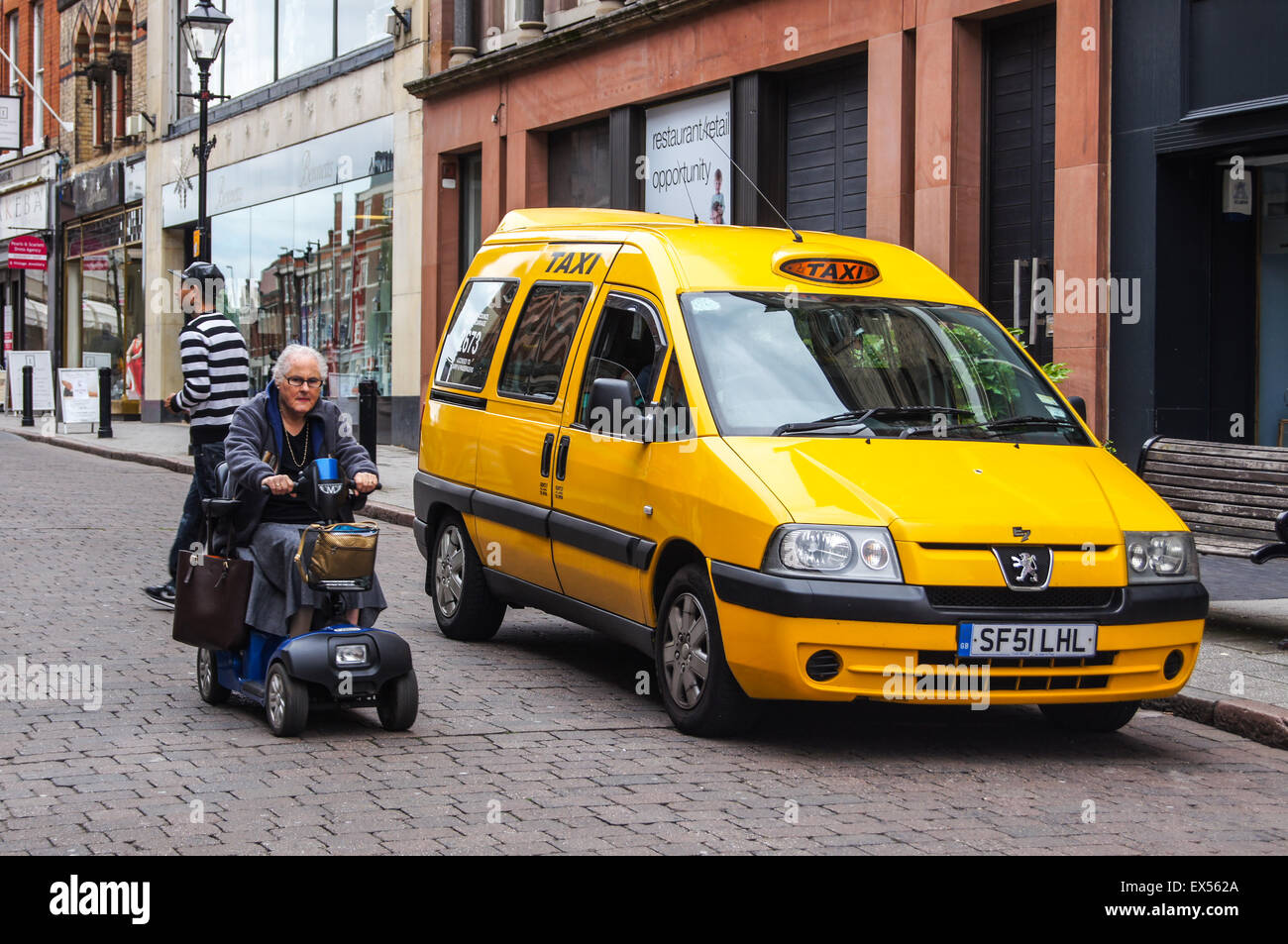 A disabled access taxi, Irongate, Derby, Derbyshire, England Stock Photo