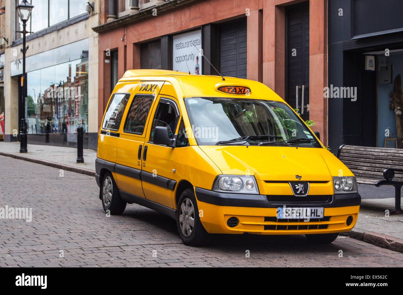 A disabled access taxi, Irongate, Derby, Derbyshire, England Stock Photo