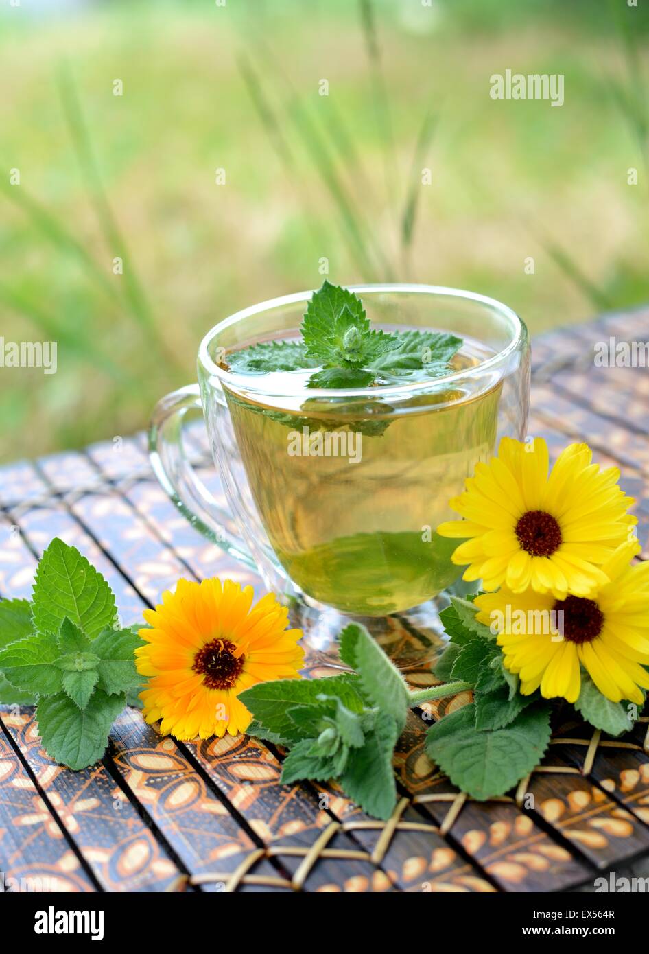 Herbal tea with marigold flowers and mint Stock Photo