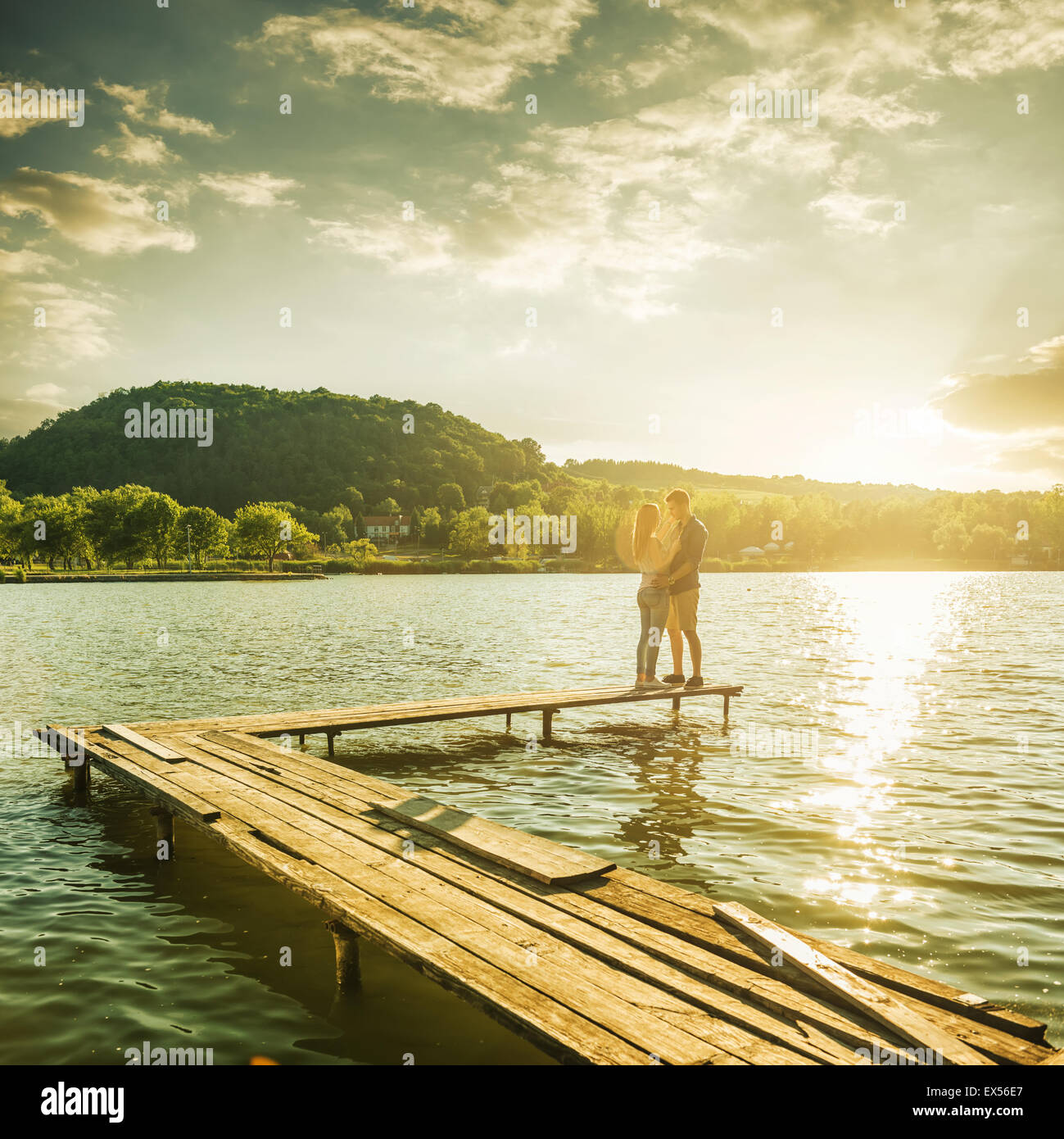 Couple embrace on the pier Stock Photo