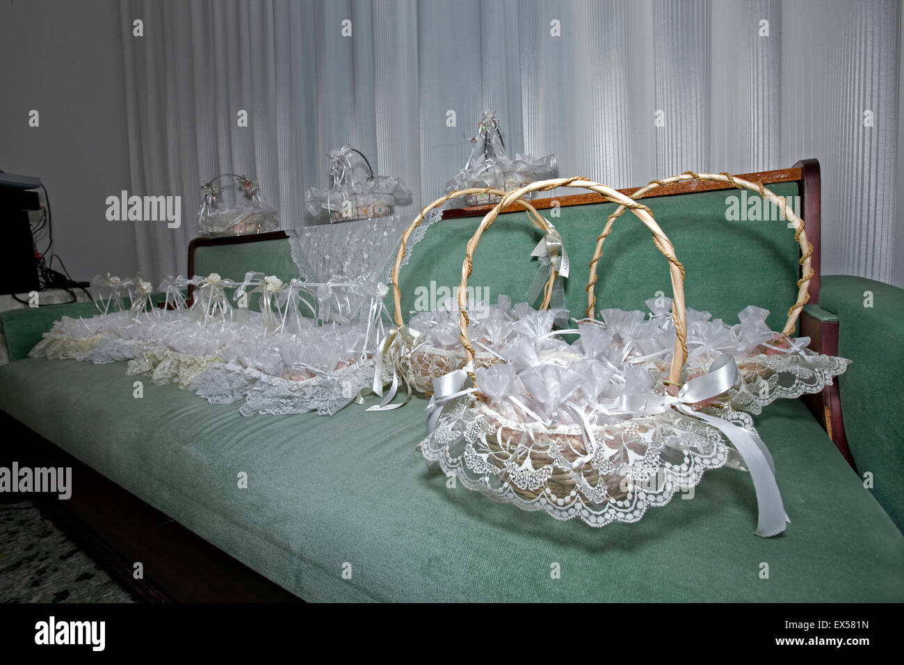 Bridal wedding rice and bonbonniere baskets on a sofa Stock Photo Alamy