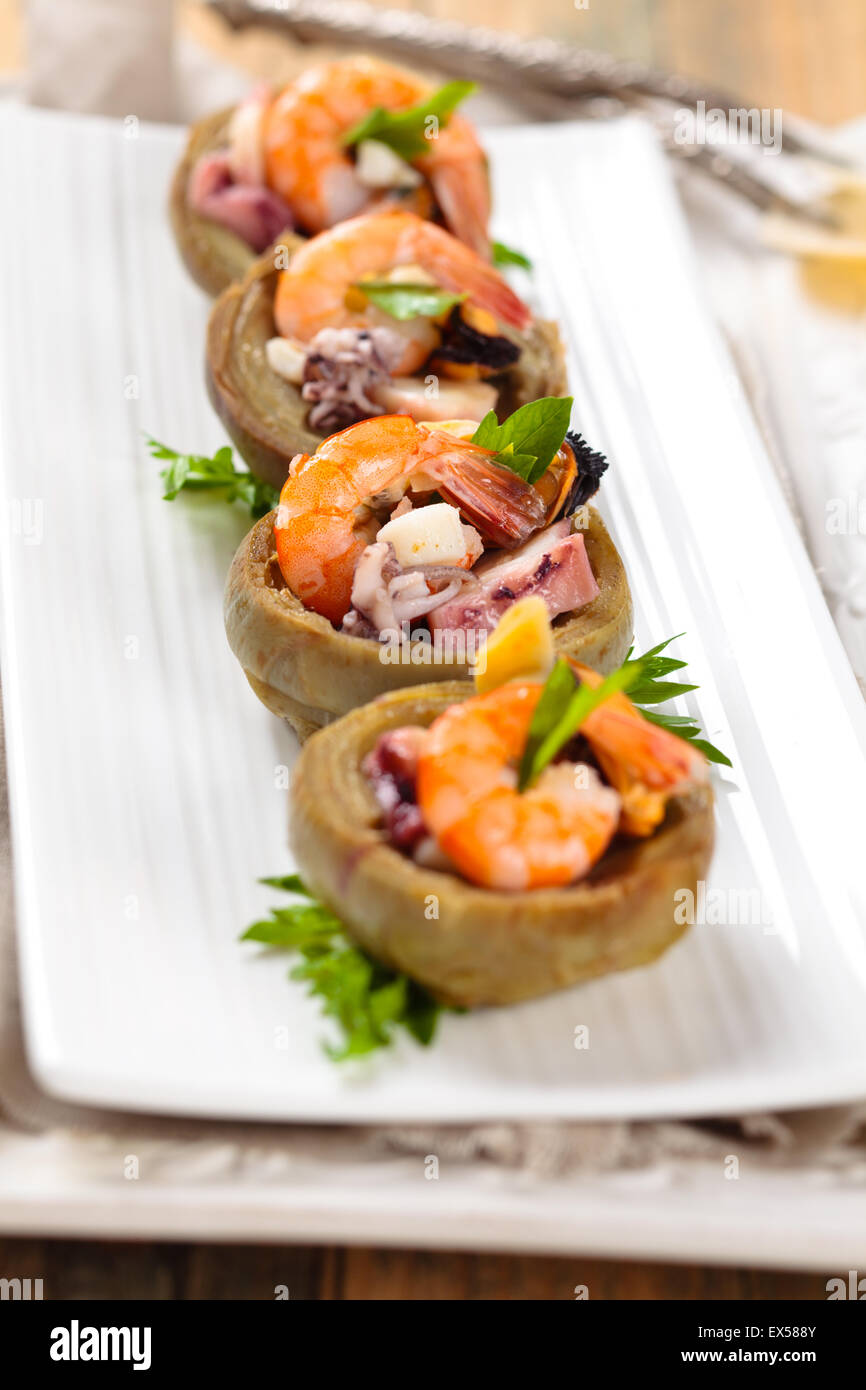Artichoke hearts stuffed with seafood Stock Photo Alamy
