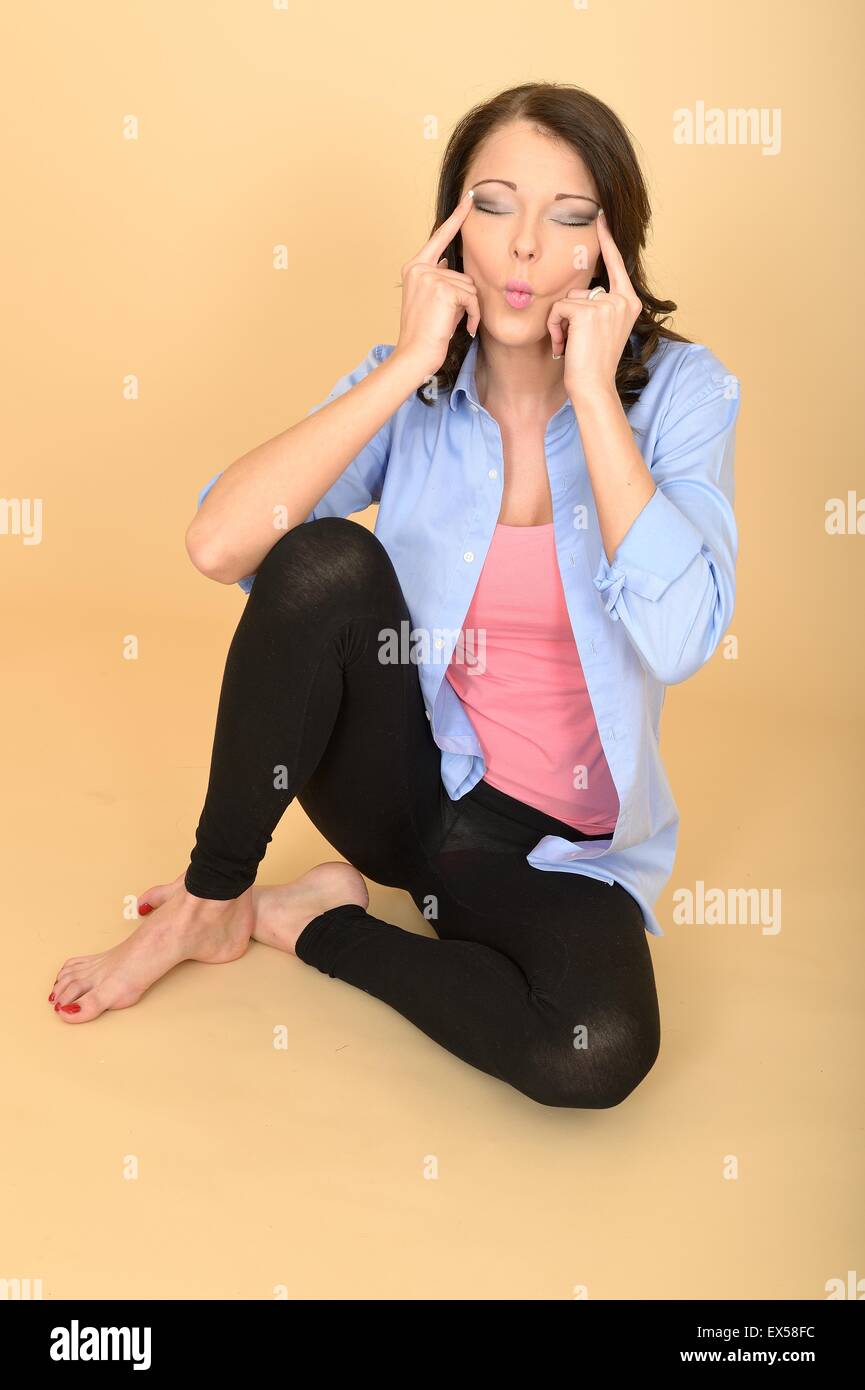 Young woman wearing leggings sitting hi-res stock photography and images -  Alamy