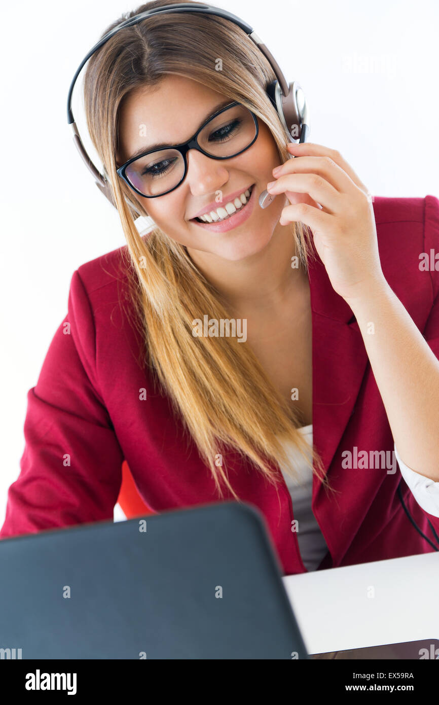 Portrait of young business girl using her computer. Stock Photo