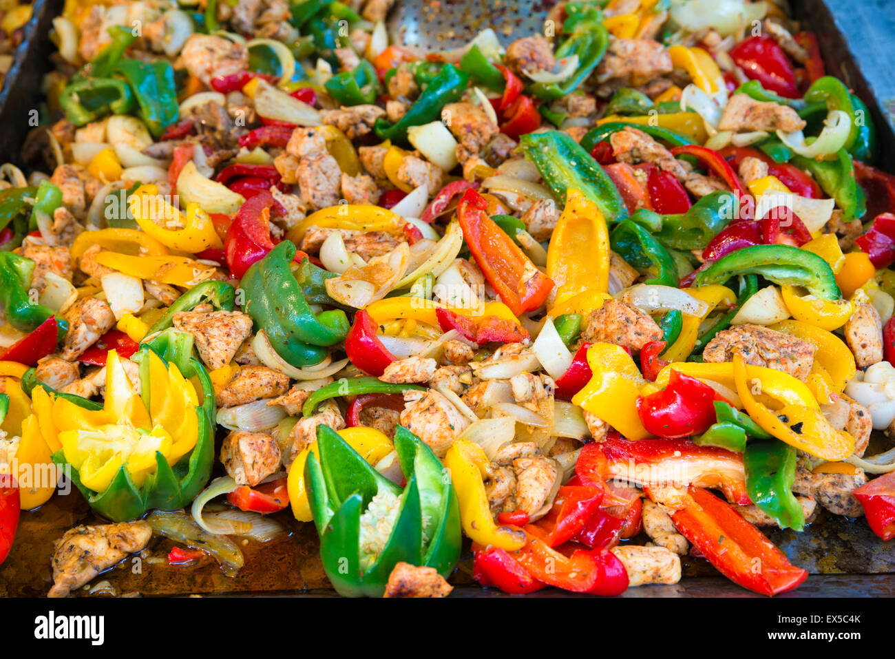 Hungarian Food - meat with yellow, red and green pepper in a pan Stock Photo