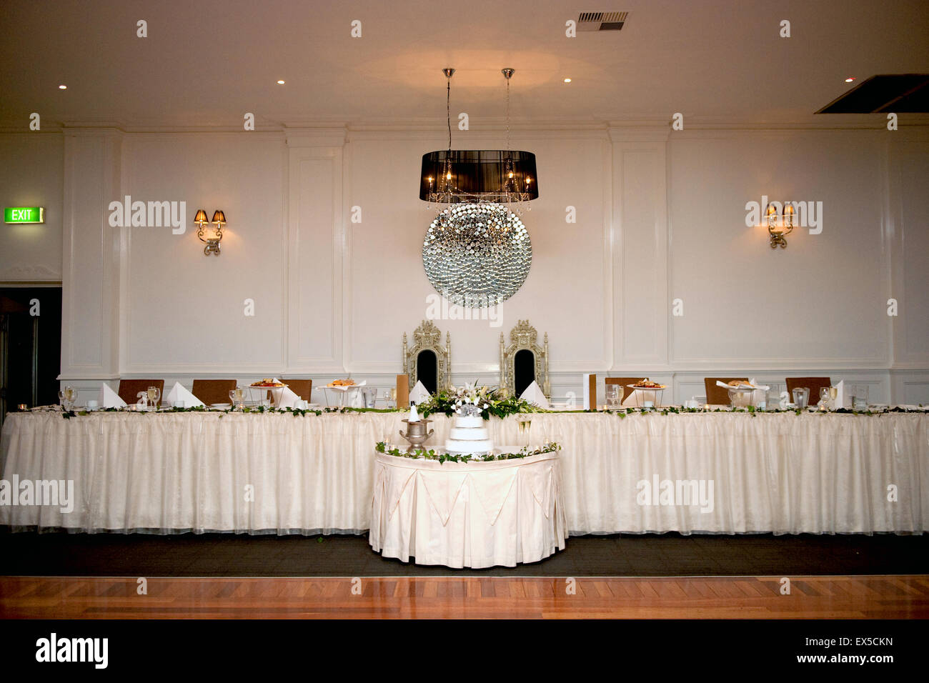 Decorated Wedding Cake In Front Of The Bridal Table At The Wedding