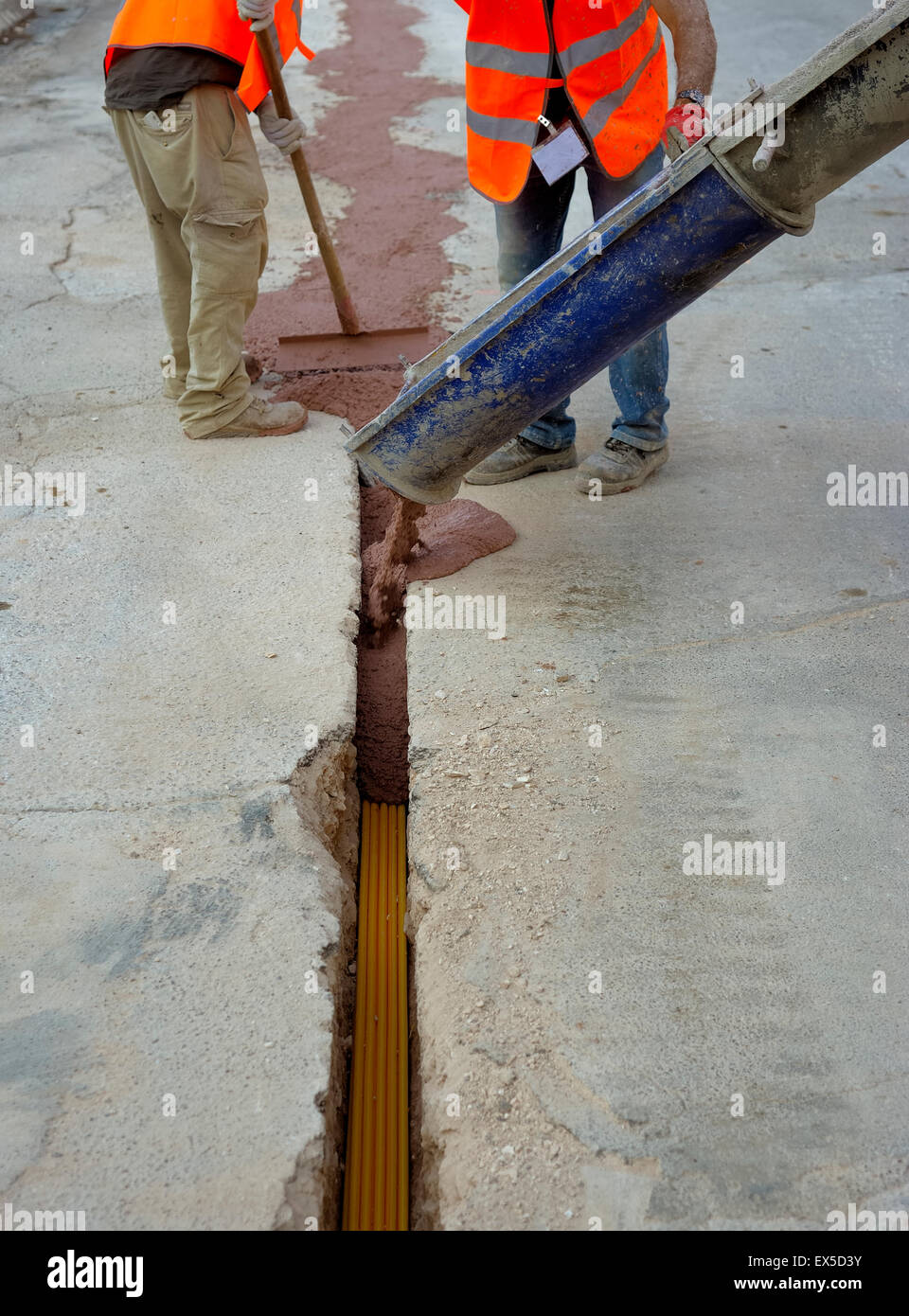 fiber optic cables buried in a micro trench by a worker Stock Photo Alamy