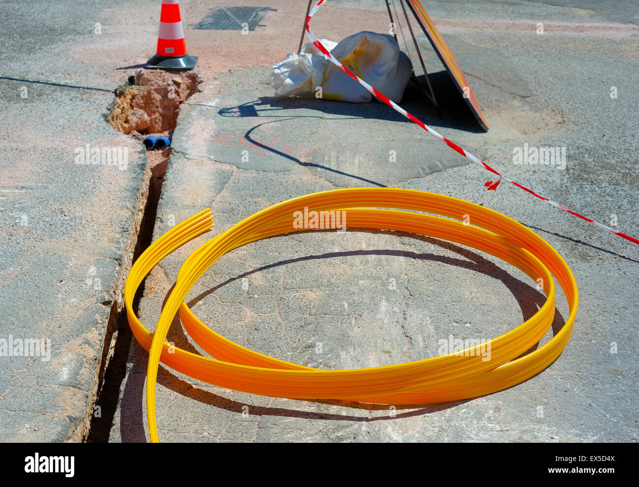 fiber optic cables buried in a micro trench Stock Photo - Alamy