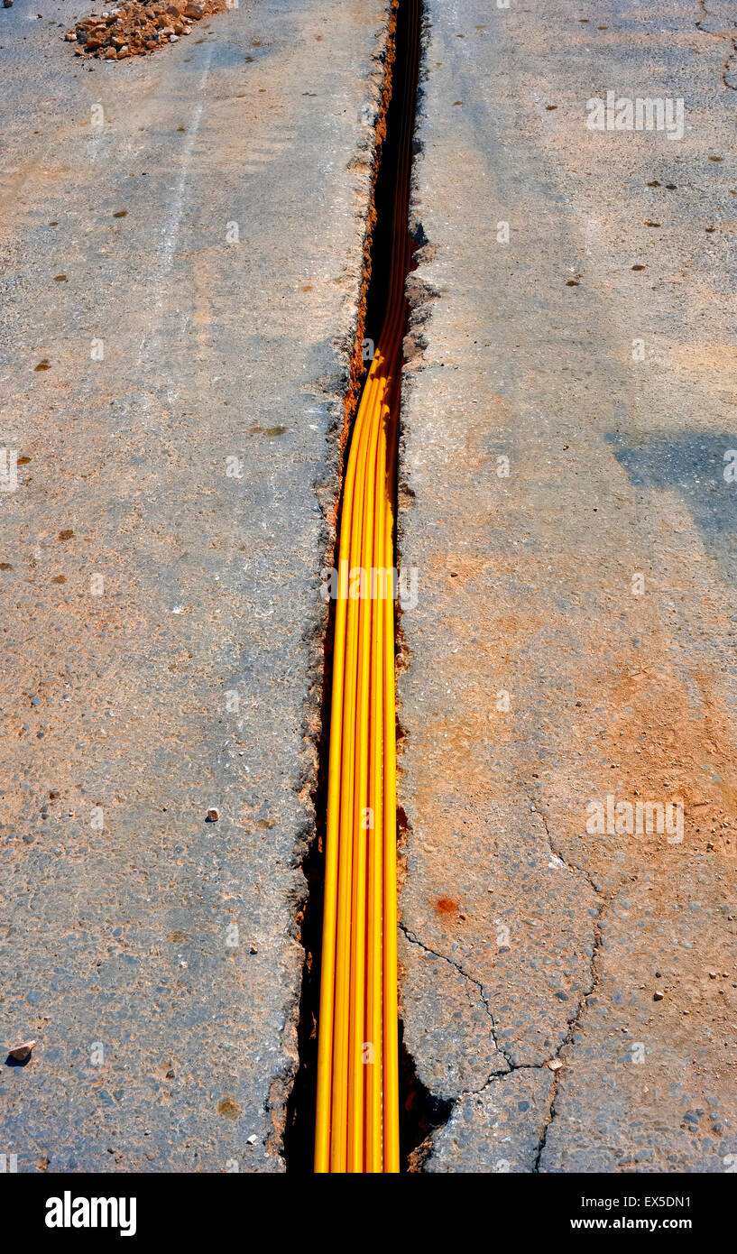 fiber optic cables buried in a micro trench Stock Photo - Alamy