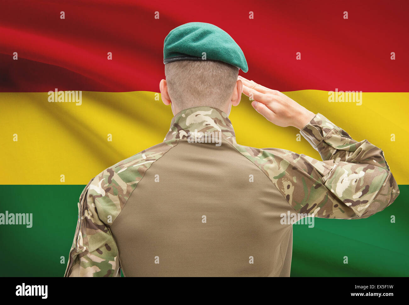 Soldier in hat facing national flag series - Bolivia Stock Photo