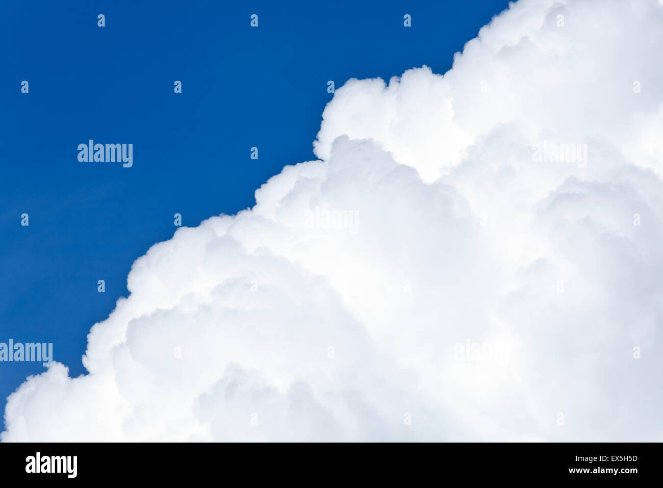 Blue sky and white background with fluffy Cumulus clouds in a distance ...