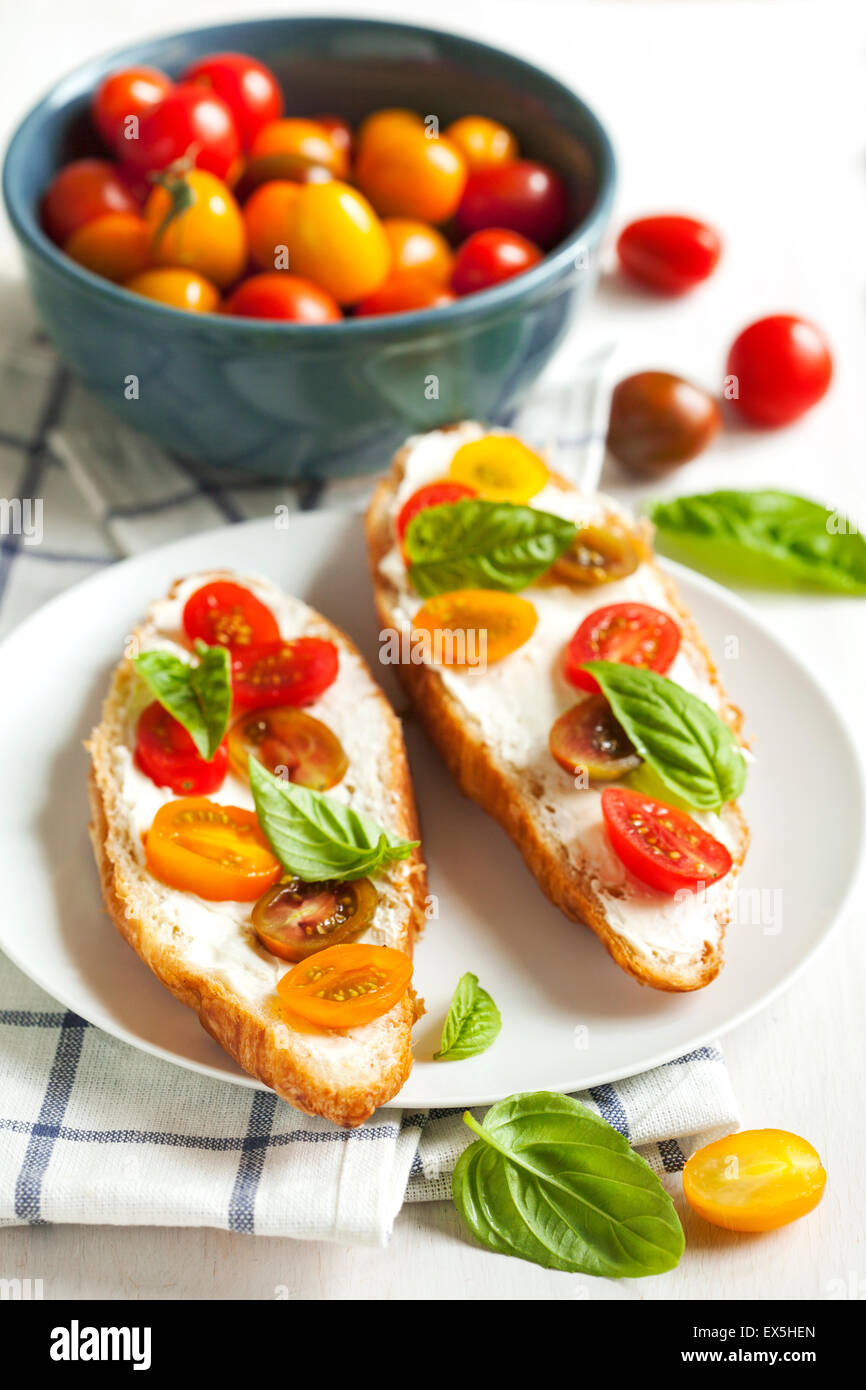 Croissant with tomato, basil and cream cheese Stock Photo