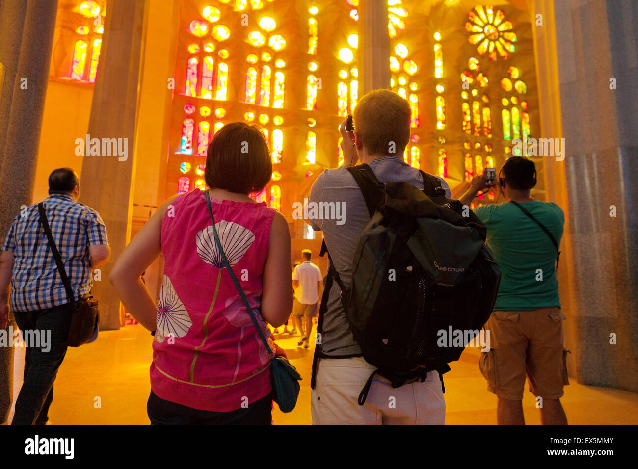 Tourists inside the Sagrada Familia Cathedral, designed by Antoni Gaudi, UNESCO World heritage site, Barcelona, Spain Europe Stock Photo