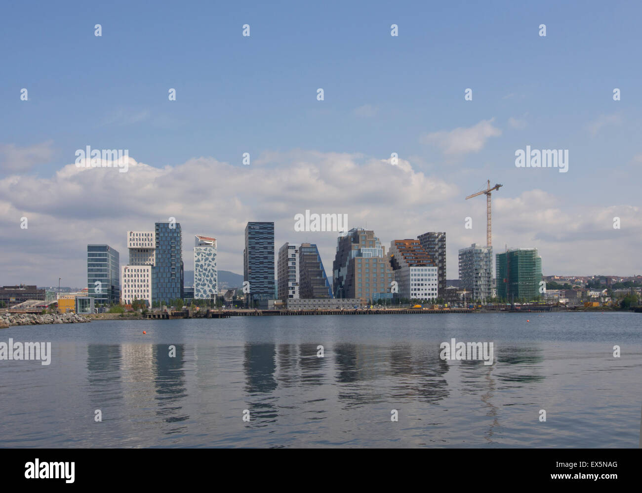 The Barcode commercial district in the center of Oslo Norway is steadily developing, highrises reflecting in the fjord, 2015 Stock Photo