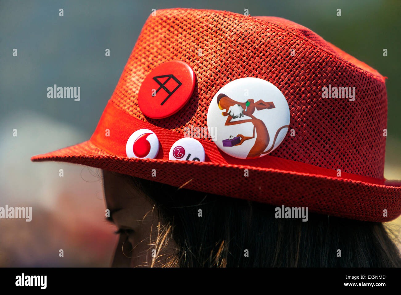 Red straw hat with buttons Stock Photo