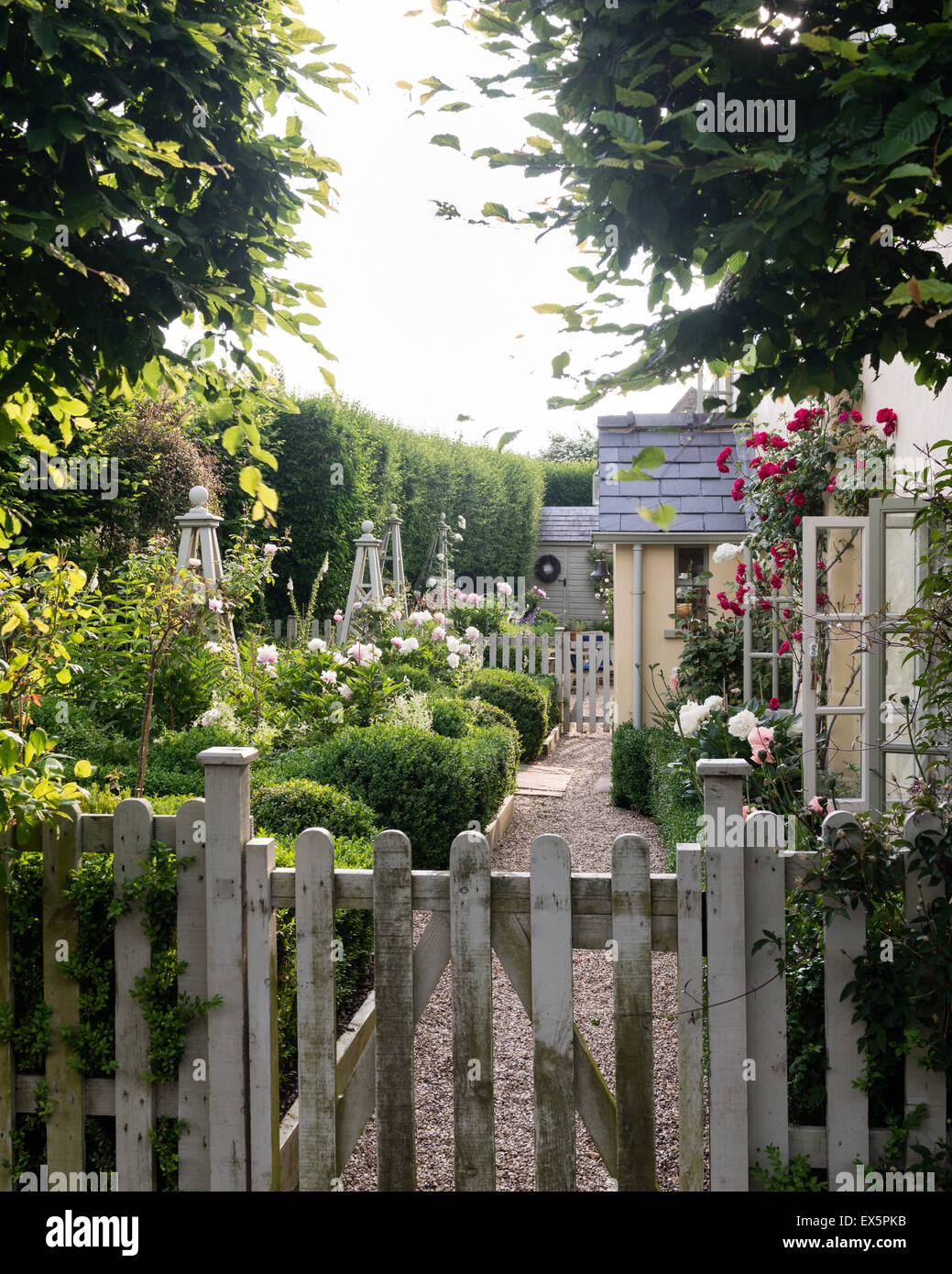 Picket gate entrance to english country cottage Stock Photo