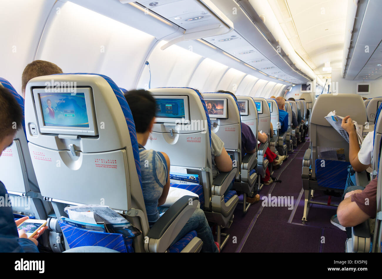 interior of a China Southern Airlines Company Limited (CSN) commercial airplane. It is the largest airline company in China and Stock Photo