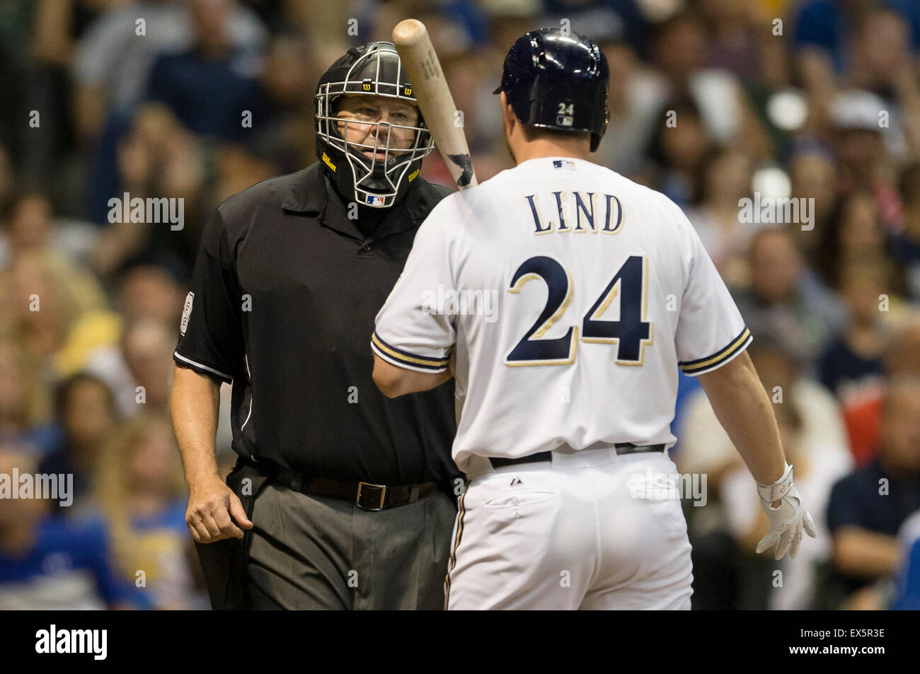 Milwaukee, WI, USA. 7th July, 2015. Milwaukee Brewers first baseman Adam Lind #24 discusses a third strike call with the home plate umpire during the Major League Baseball game between the Milwaukee Brewers and the Atlanta Braves at Miller Park in Milwaukee, WI. Atlanta defeated Brewers 5-3. John Fisher/CSM/Alamy Live News Stock Photo