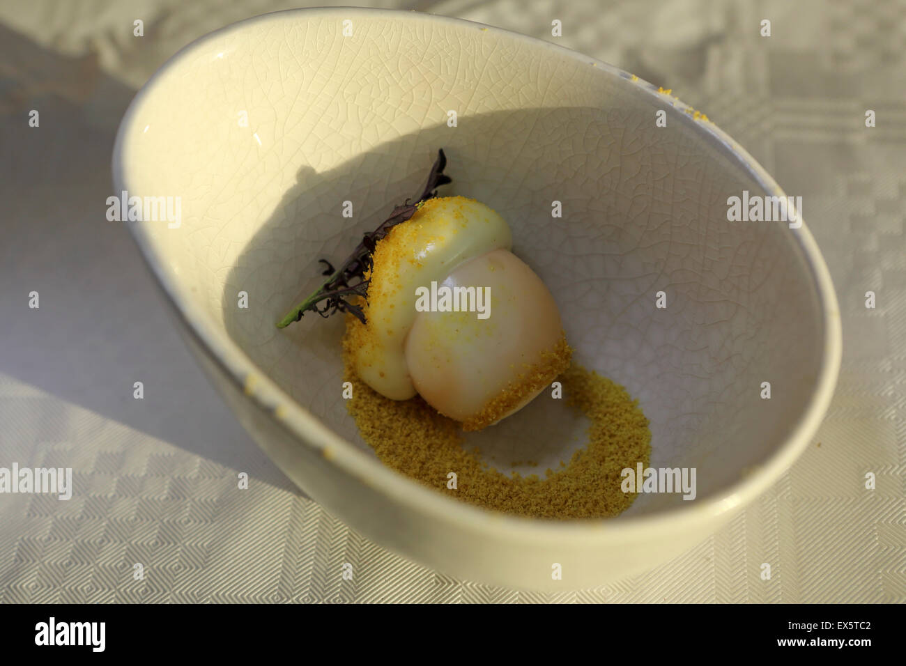 Smoked quail egg served with powdered mustard and mayonnaise at the