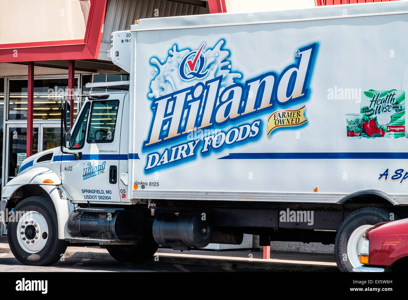 A Hiland delivery truck delivers dairy products to a Dollar General store in Oklahoma City, Oklahoma, USA. Stock Photo