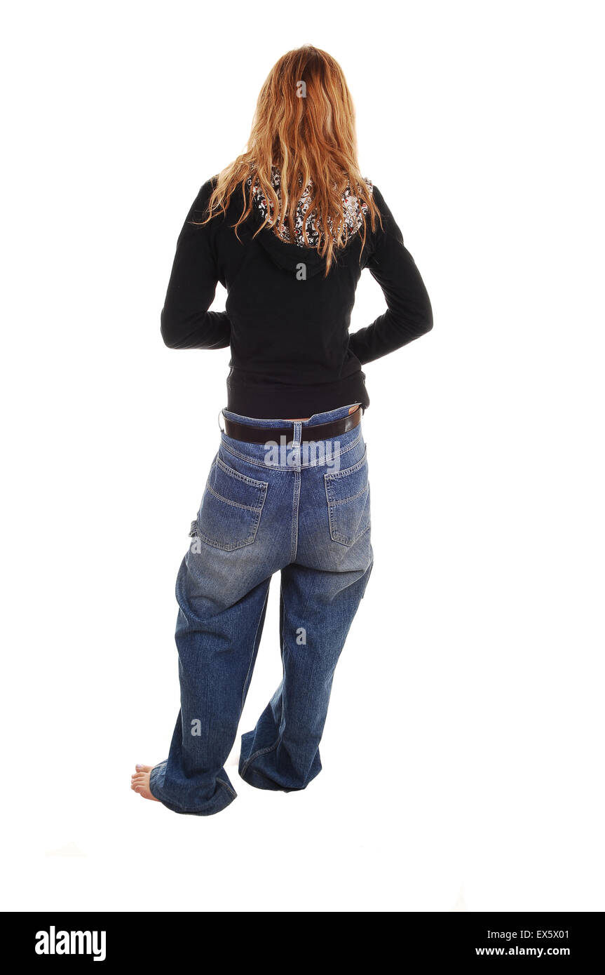 A young teenage girl is wearing her jeans so low, it falls almost down ...