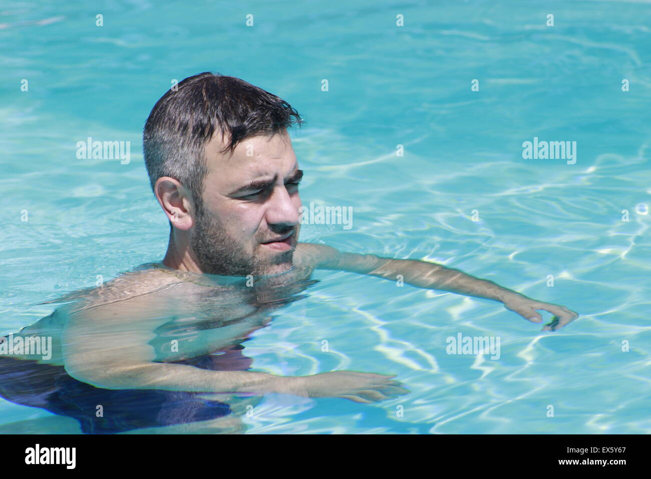 man relaxing in the pool Stock Photo