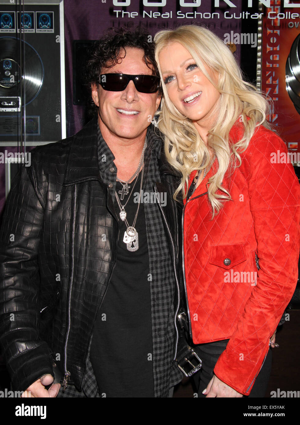 Journey unveils memorabilia cases at The Hard Rock Hotel & Casino in Las Vegas  Featuring: Neal Schon, Michaele Schon, Journey Where: Las Vegas, Nevada, United States When: 06 May 2015 C Stock Photo