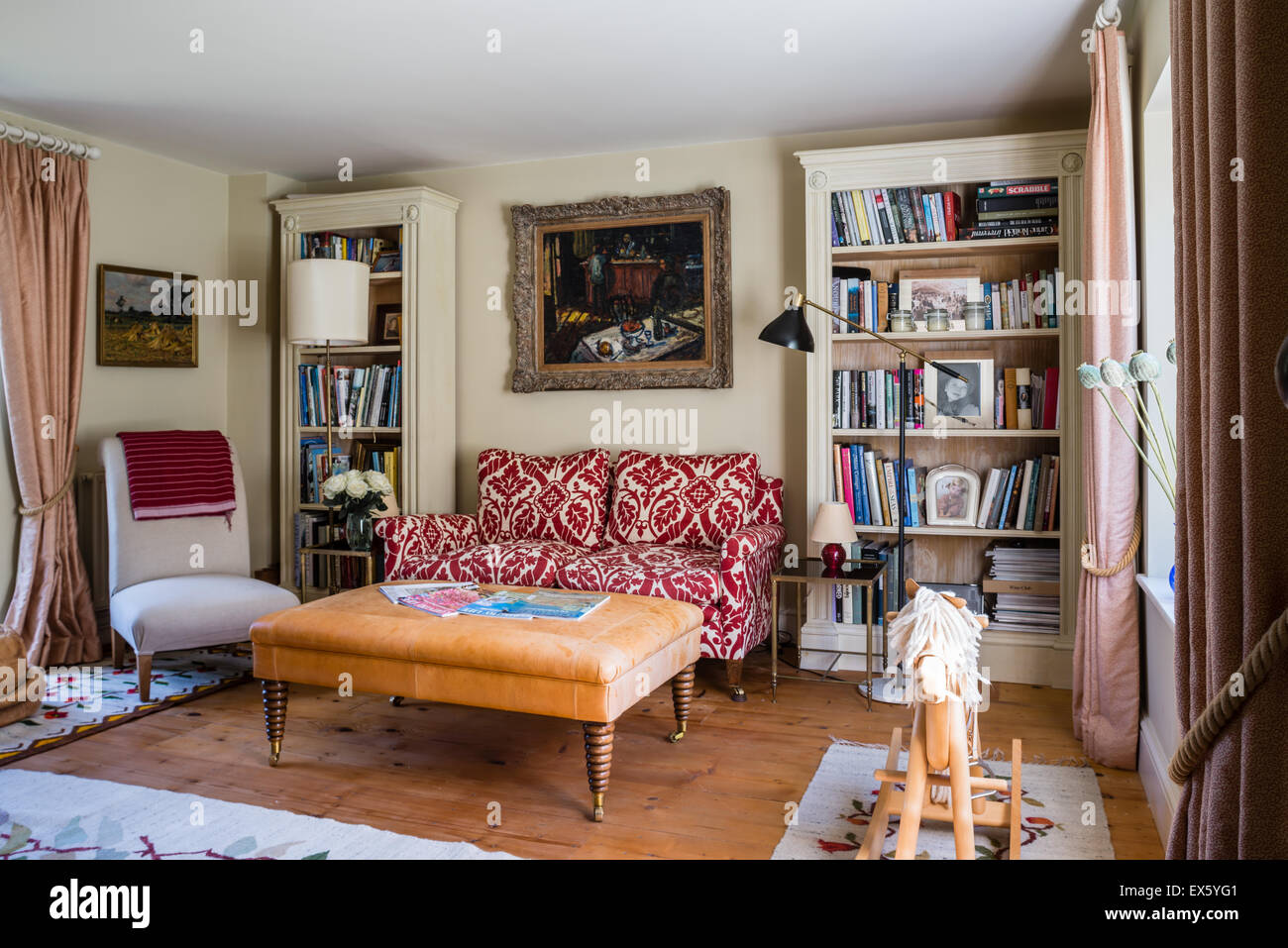 Painting by Arbit Blatas above Christopher Howe printed linen sofa in