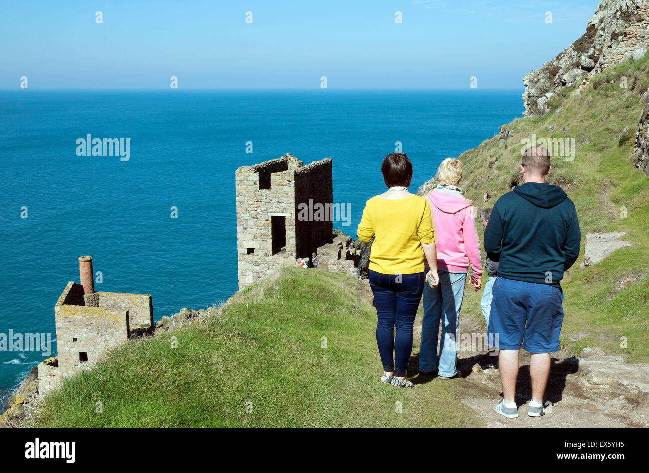 Tourists visiting Botallack Crowns Tin MIne in Cornwall, England, UK,  one of the Poldark television series filming locations. Stock Photo