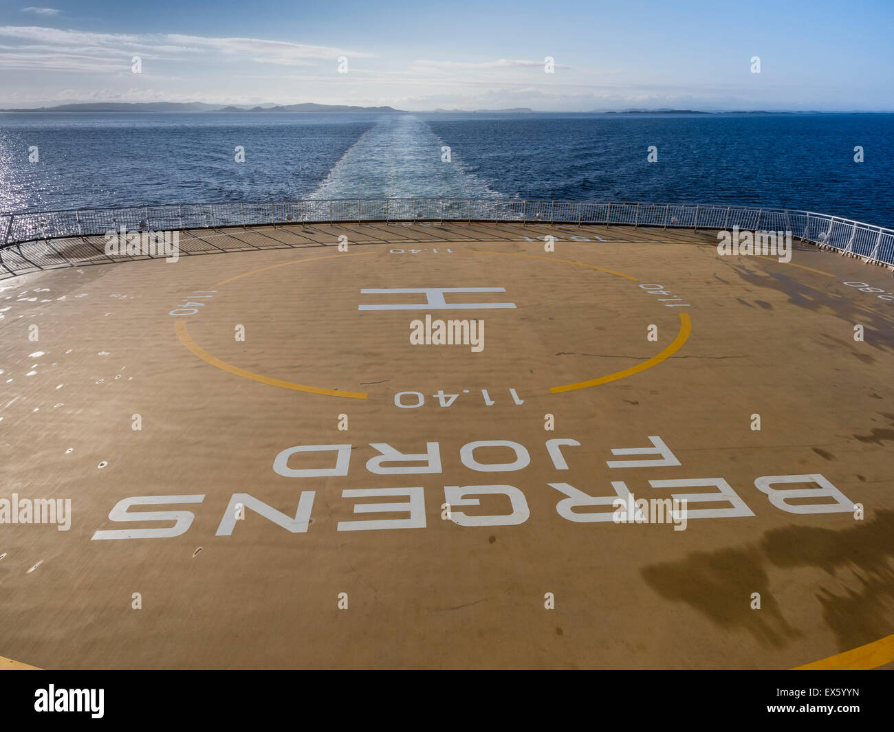 Ferry of the Fjordline compayn, Danmark-Norway, helicopter landing area, norwegian coast in the background. Stock Photo