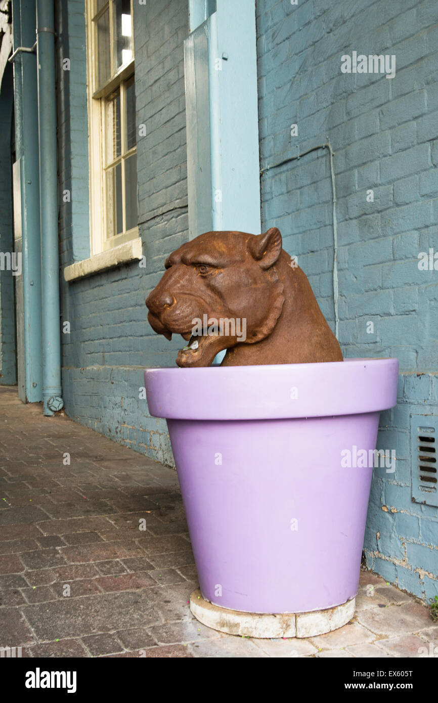 Panther sculpture in a purple pot. Stock Photo
