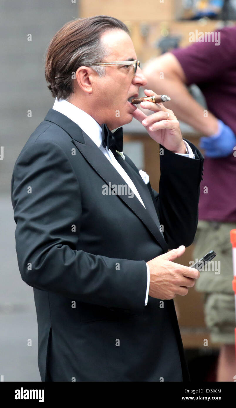 Boston, Massachusetts, USA. 7th July, 2015. Actor Andy Garcia smokes a  cigar and uses a cellphone while on the movie set of 'Ghostbusters' in  Boston, Massachusetts. Credit: Nicolaus Czarnecki/ZUMA Wire/Alamy Live News